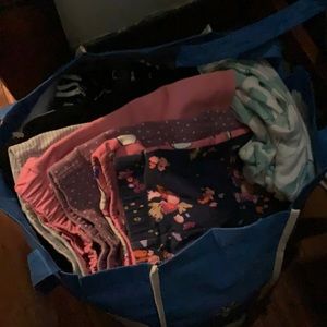 Bag full of baby girl clothes